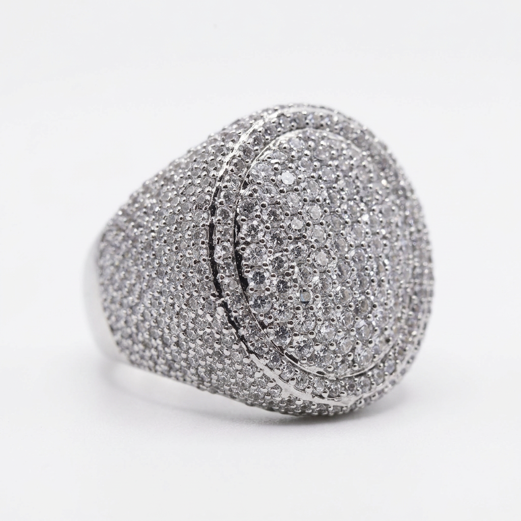 Close-up of Chunky Gem’s oval pavé CZ face, surrounding halo and silver-tone stone-set shoulders.